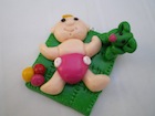 Pendentif bébé tapis de jeux